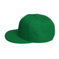 Green flat-brimmed snapback hat featuring a stylish crown design for streetwear enthusiasts