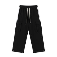 Black cargo pants with white stripes.