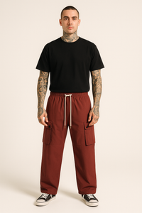 Man in black t-shirt and maroon cargo pants.