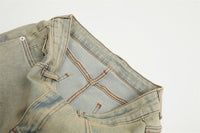 Distressed light wash denim jeans.
