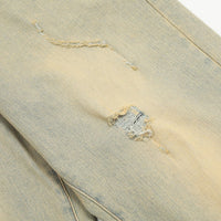 Distressed denim fabric.