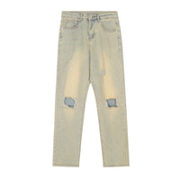 Ripped light wash jeans.