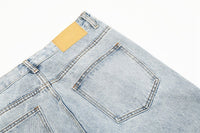 Light-wash denim jeans.