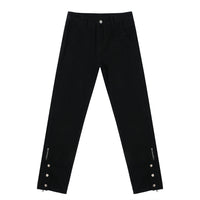 Black straight-leg pants with zipper and button details.