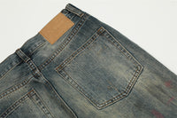 Distressed blue denim jeans.