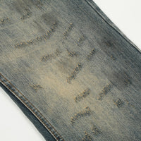 Distressed blue denim jeans.