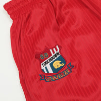 Red Retro Track Pants featuring embroidered emblem on stylish athletic shorts