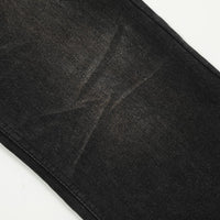 Black denim fabric of Retro Black Baggy Jeans showcasing its durable and stylish design