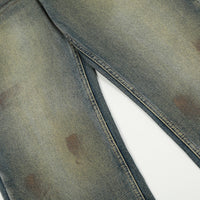 Distressed denim jeans.