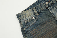 Distressed denim jeans.