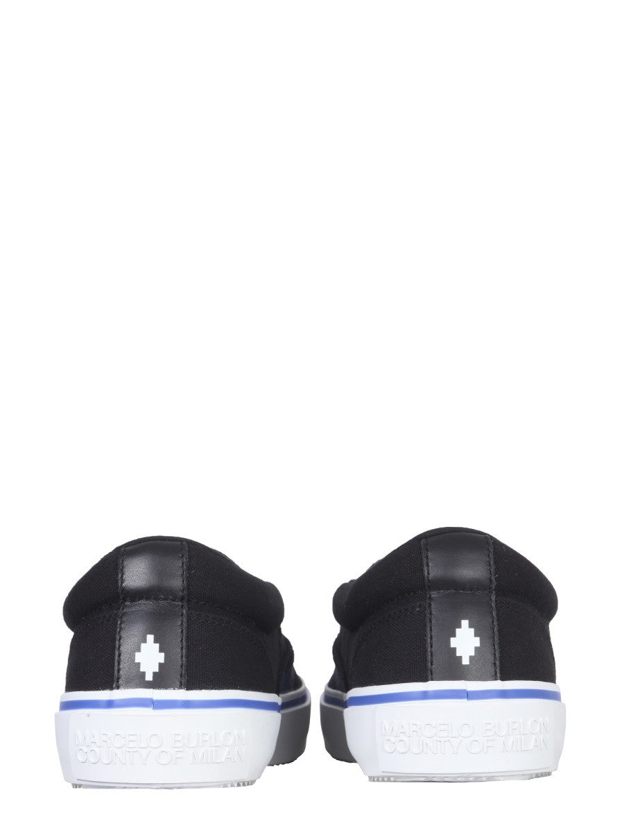 Vulkaniserade slip-ons med fågeltryck