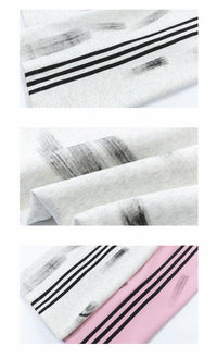 Fabric with brushstroke and stripe patterns.